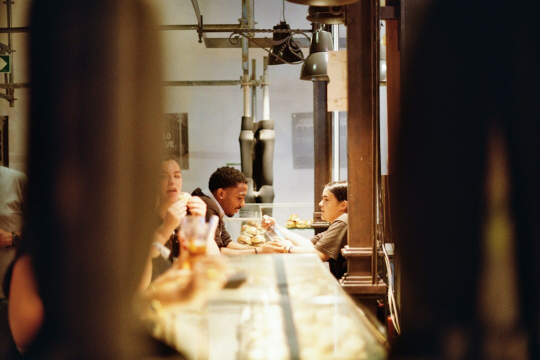 Manager leading a team discussion around a table